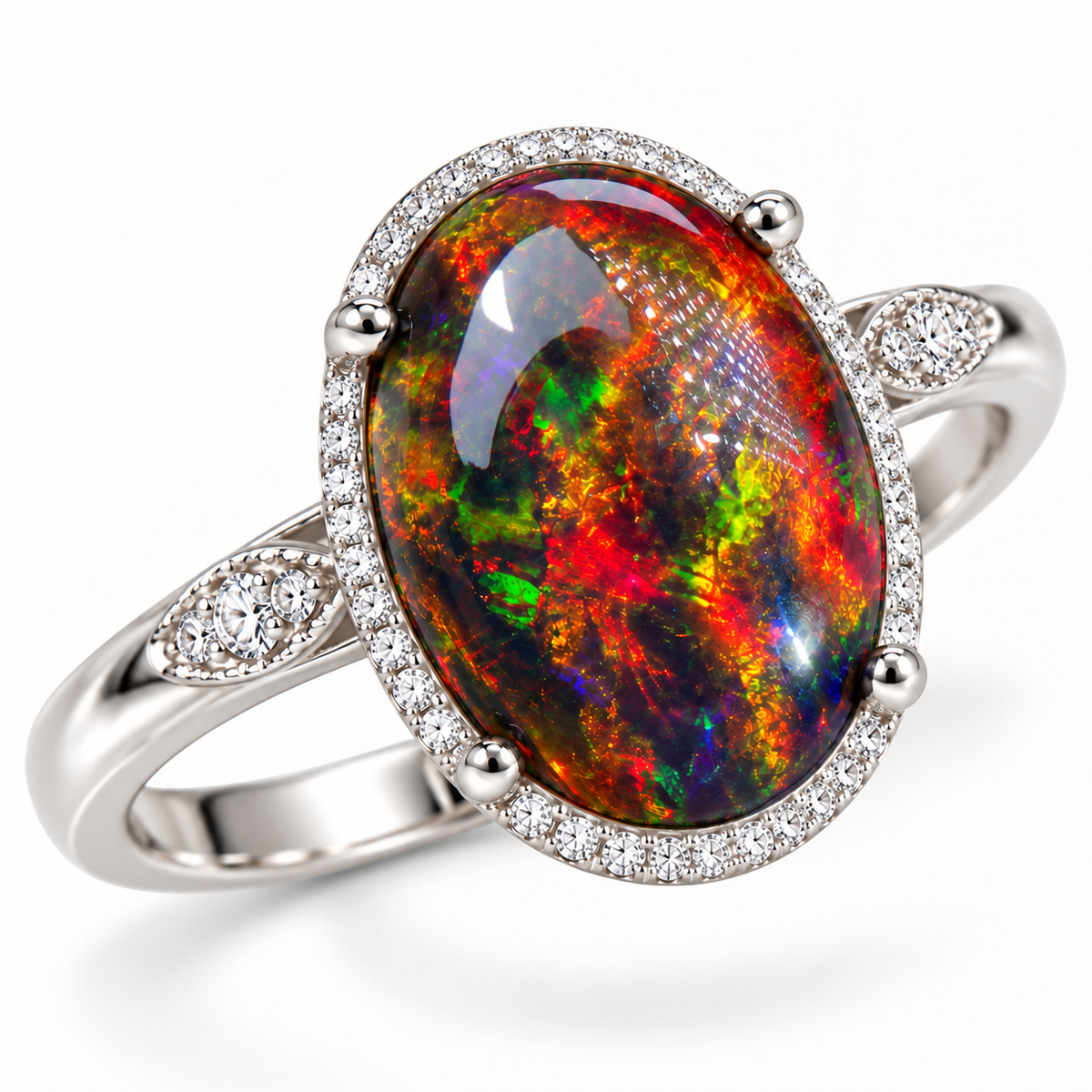 Angled view of a 10x14mm black fire opal ring featuring a colorful oval gemstone, four rounded prongs, a sparkling silver-tone halo, and decorative stone-set shoulders.