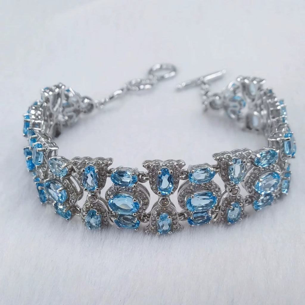 925 Silver Polished Natural Swiss Blue Topaz 4x6mm Oval-Cut Link Tennis Bracelet