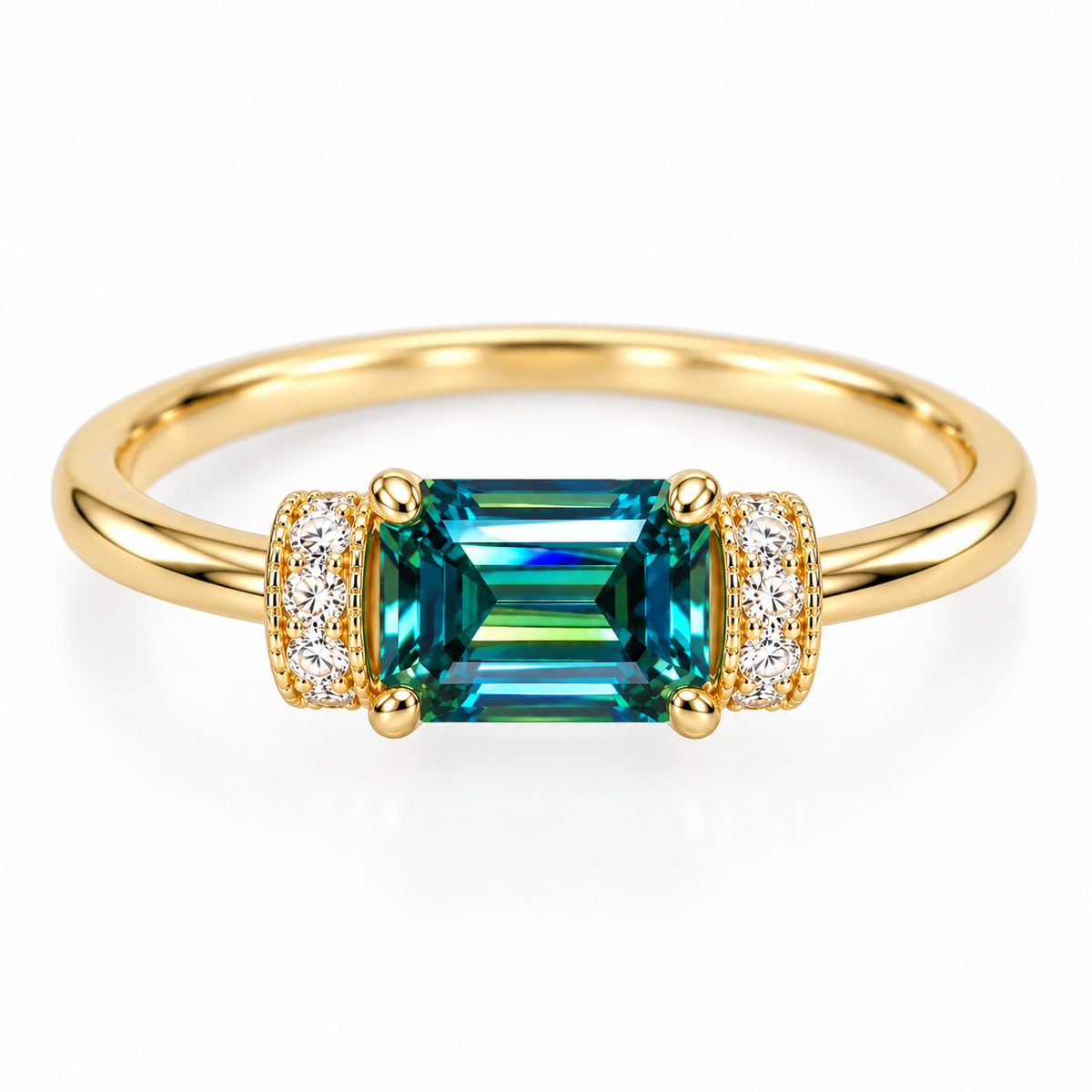 Top-down view of a 5x7mm emerald-cut green moissanite ring showing the horizontally positioned teal-green gemstone, symmetrical cubic zirconia accents, and polished Gold Plated sterling silver band.