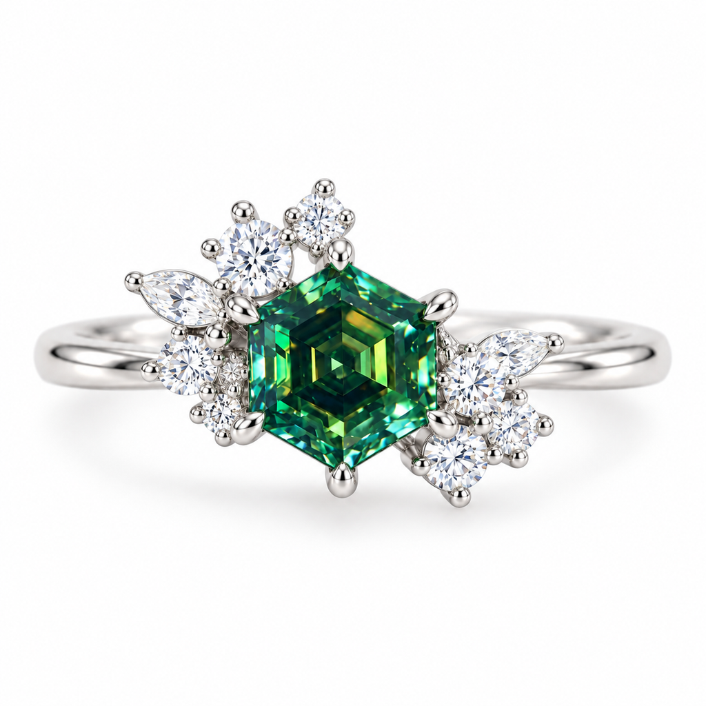 Top-down view of a 6mm hexagon-cut green moissanite ring highlighting the gemstone's symmetrical geometric facets, rich green and teal reflections, and asymmetrical floral cubic zirconia setting in sterling silver.