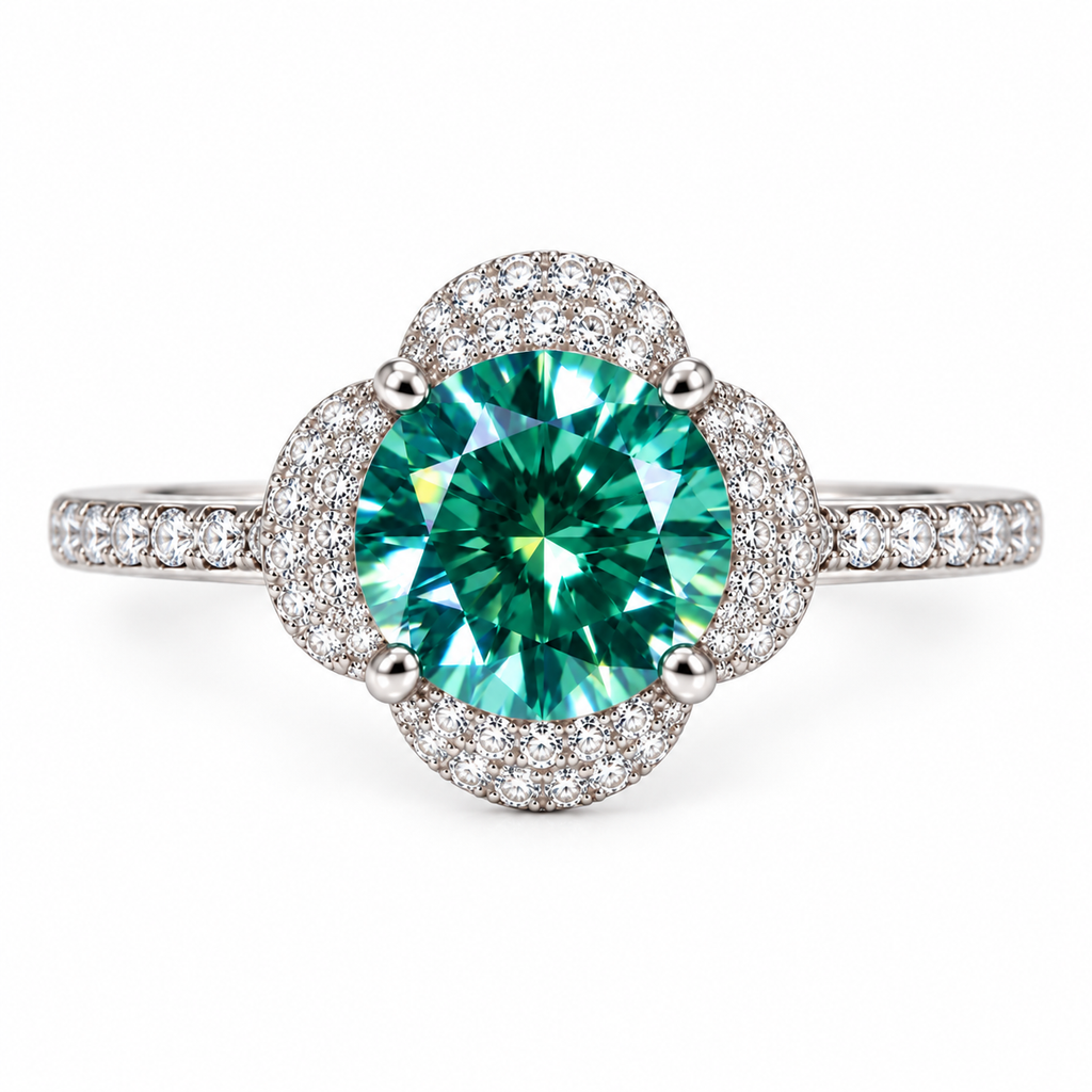 Top-down view of an 8mm round brilliant green moissanite ring highlighting the 2 carat lab-created center gemstone, symmetrical four-petal floral halo, delicate cubic zirconia detailing, and slender pavé-accented sterling silver band.