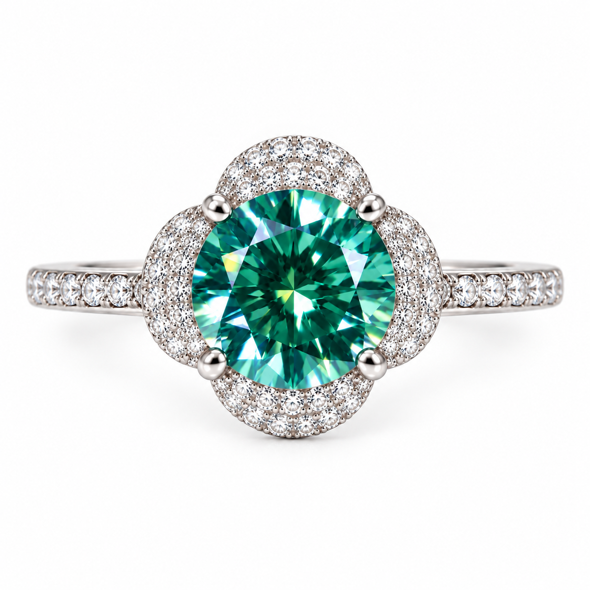 Top-down view of an 8mm round brilliant green moissanite ring highlighting the 2 carat lab-created center gemstone, symmetrical four-petal floral halo, delicate cubic zirconia detailing, and slender pavé-accented sterling silver band.