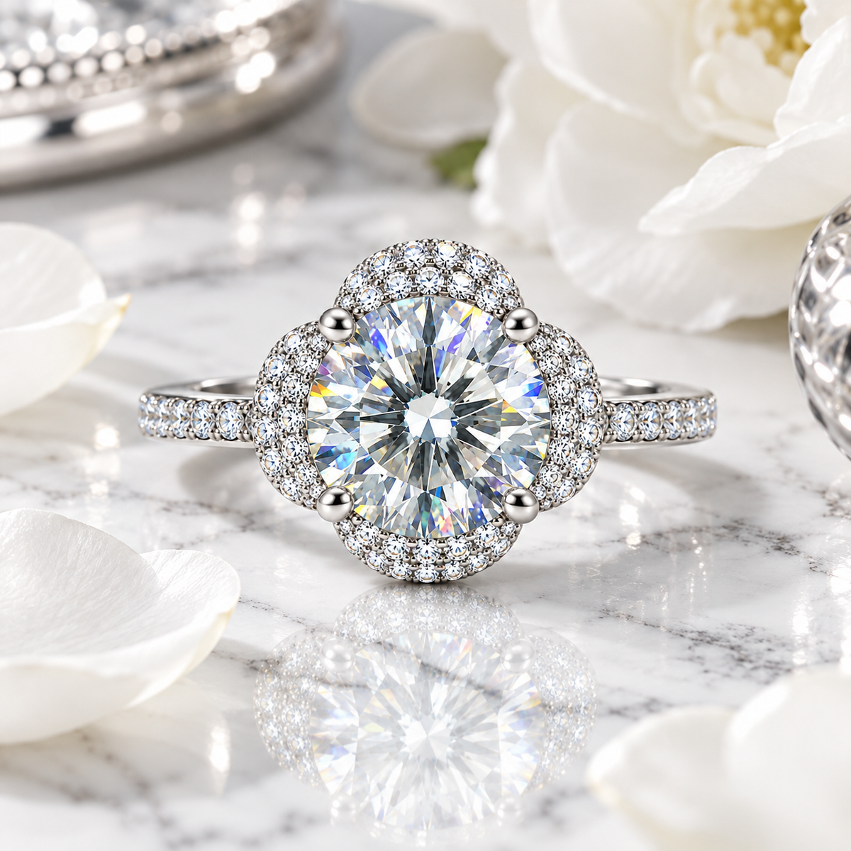 2 carat white moissanite floral halo ring resting on elegant white marble with silver-gray veining, surrounded by soft pure white flowers and polished silver accents.