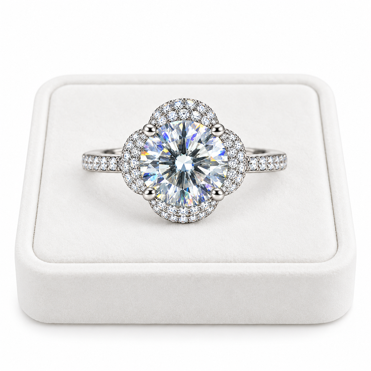 2 carat round brilliant white moissanite floral halo ring displayed on a premium white velvet jewelry tray with a pure white background, featuring a brilliant 8mm center gemstone and sparkling sterling silver setting.