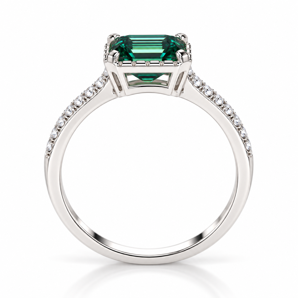 Side profile of a 2 carat lab-created green moissanite ring highlighting the 6x8mm emerald-cut gemstone, four-prong setting, polished silver-colored gallery, and slender 925 sterling silver band with cubic zirconia accents.