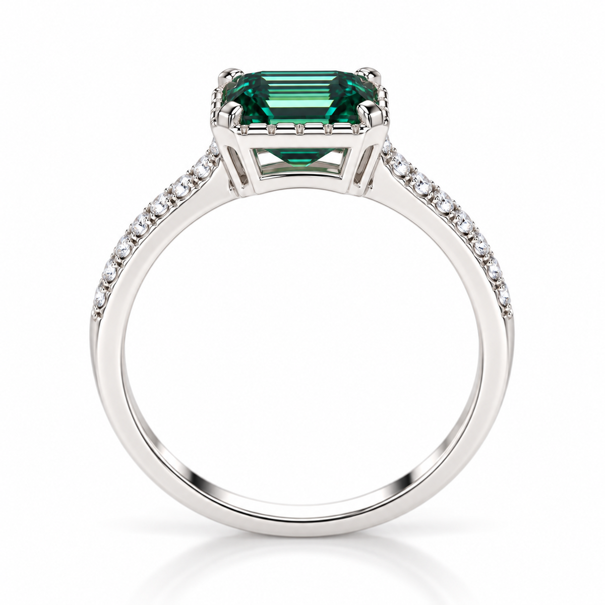 Side profile of a 2 carat lab-created green moissanite ring highlighting the 6x8mm emerald-cut gemstone, four-prong setting, polished silver-colored gallery, and slender 925 sterling silver band with cubic zirconia accents.