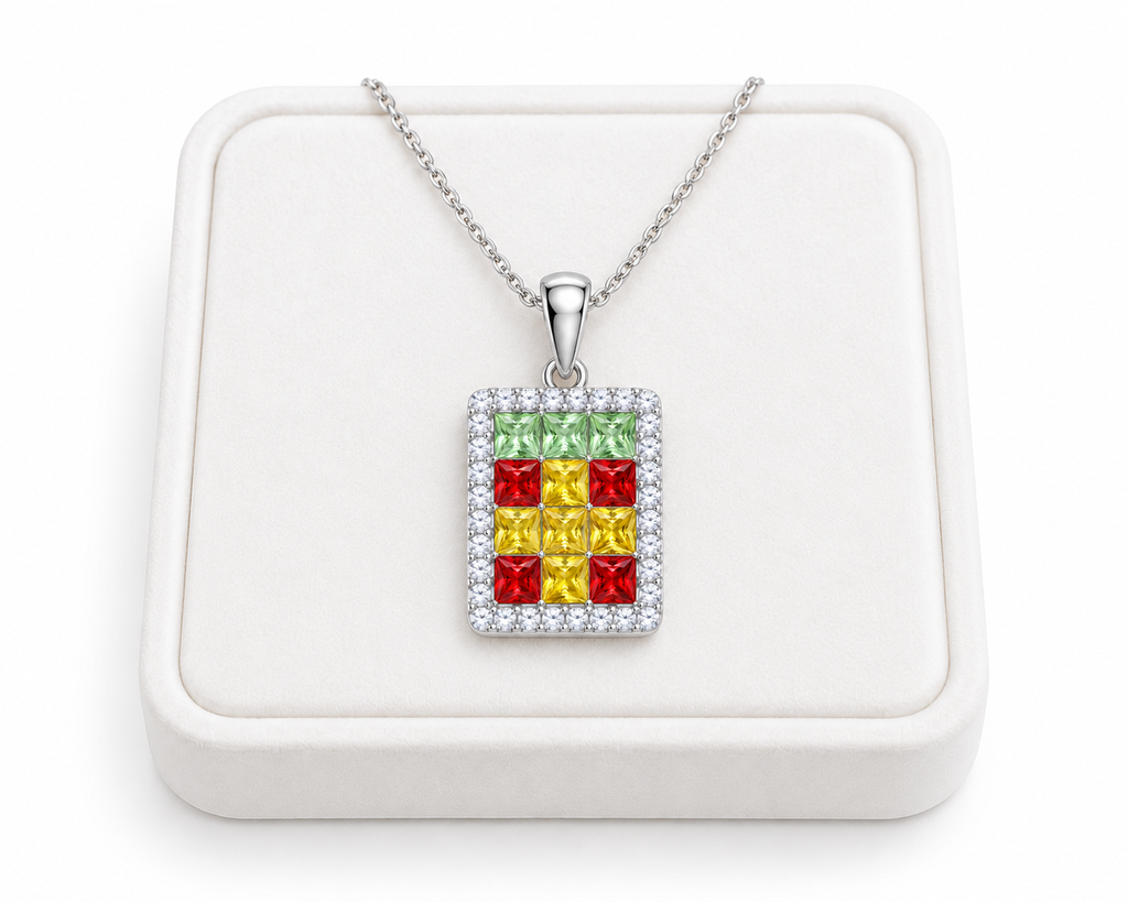 Multicolor gemstone pendant necklace displayed on a white velvet jewelry tray