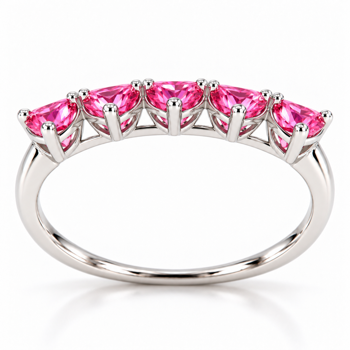Side view of five 4mm heart-cut pink moissanite gemstones on a curved sterling silver ring