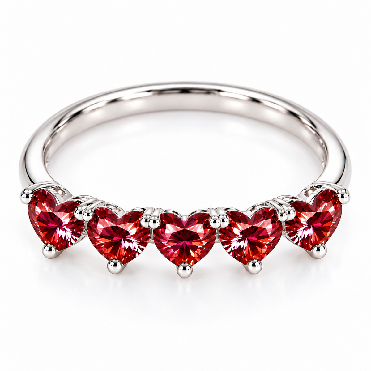 Front view of five matching 4mm heart-cut red moissanite gemstones on a polished sterling silver ring