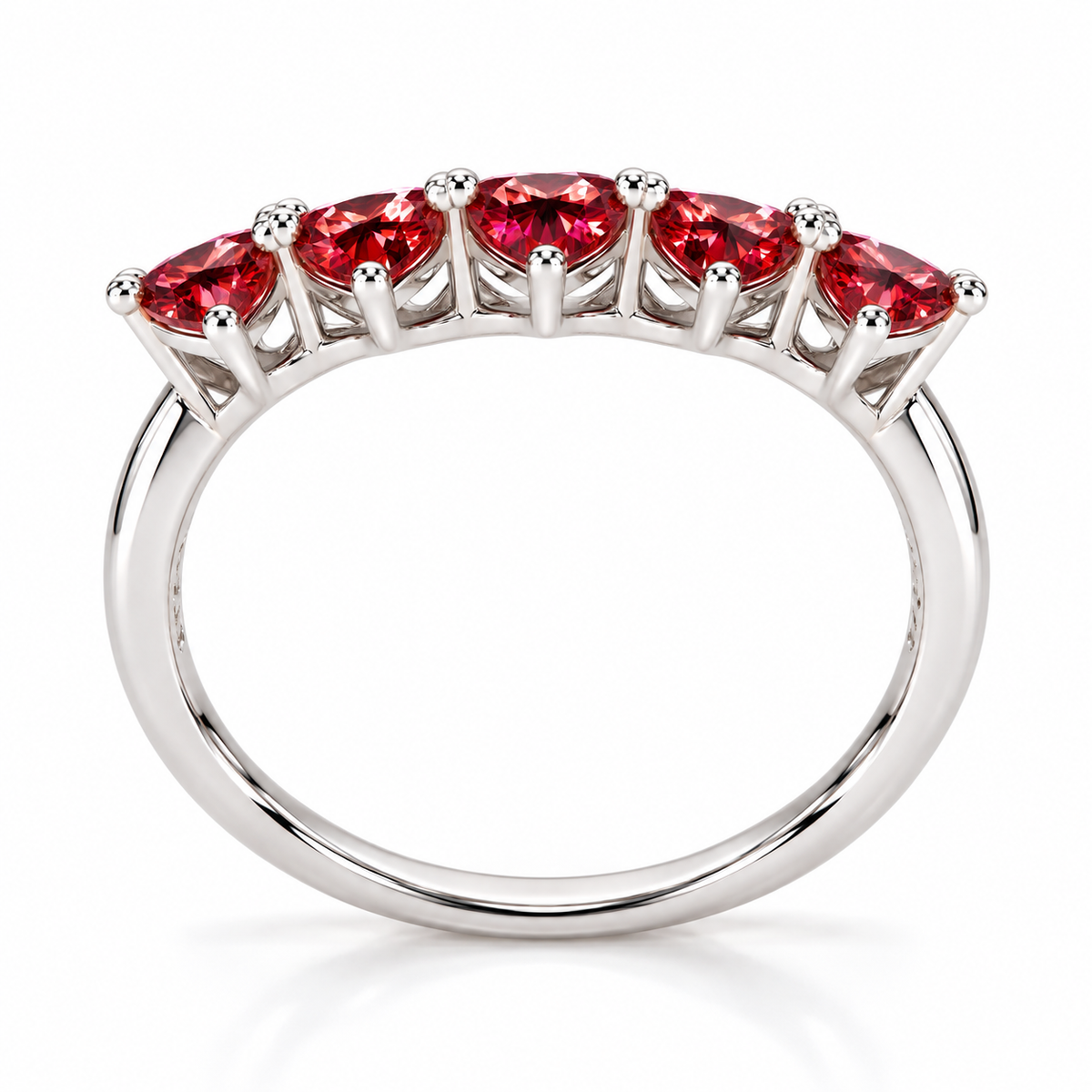Side view showing five 4mm heart-cut red moissanite gemstones and the curved sterling silver ring band