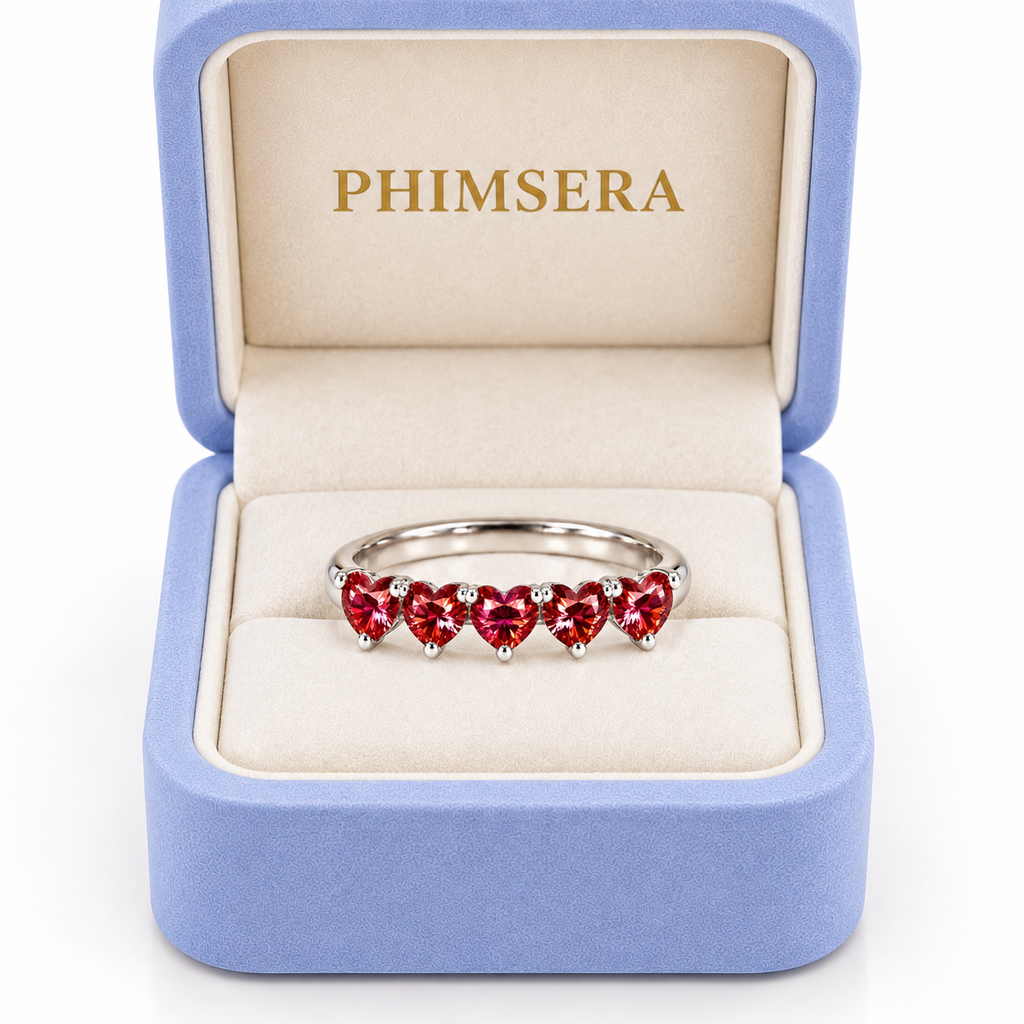 Five 4mm heart-cut red moissanite ring presented in a Phimsera jewelry gift box