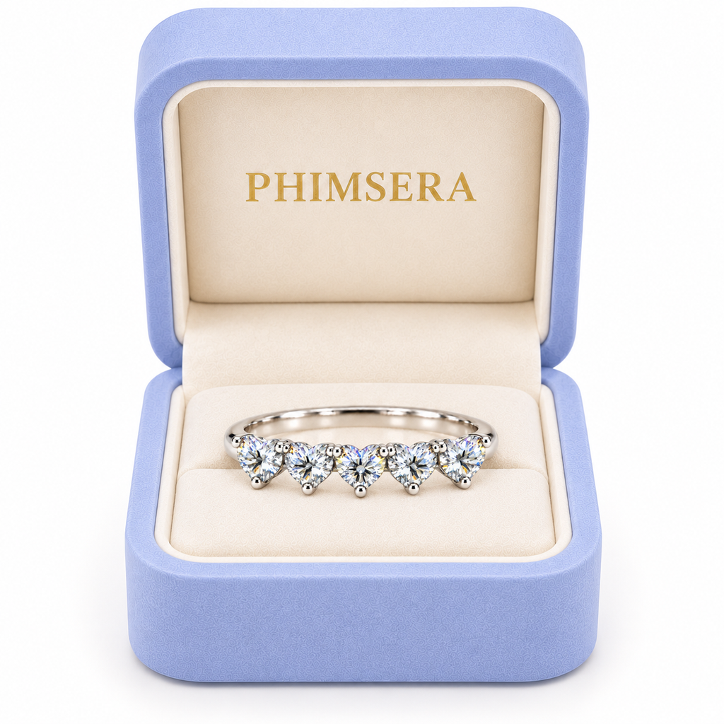 Five 4mm heart-cut white moissanite ring presented in a Phimsera jewelry box