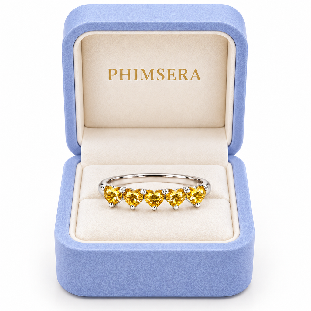 Five 4mm heart-cut yellow moissanite ring presented in a Phimsera jewelry gift box