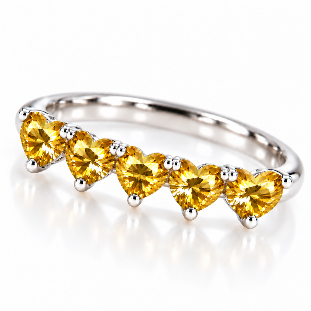 Front view of five matching 4mm heart-cut yellow moissanite gemstones on a polished sterling silver ring