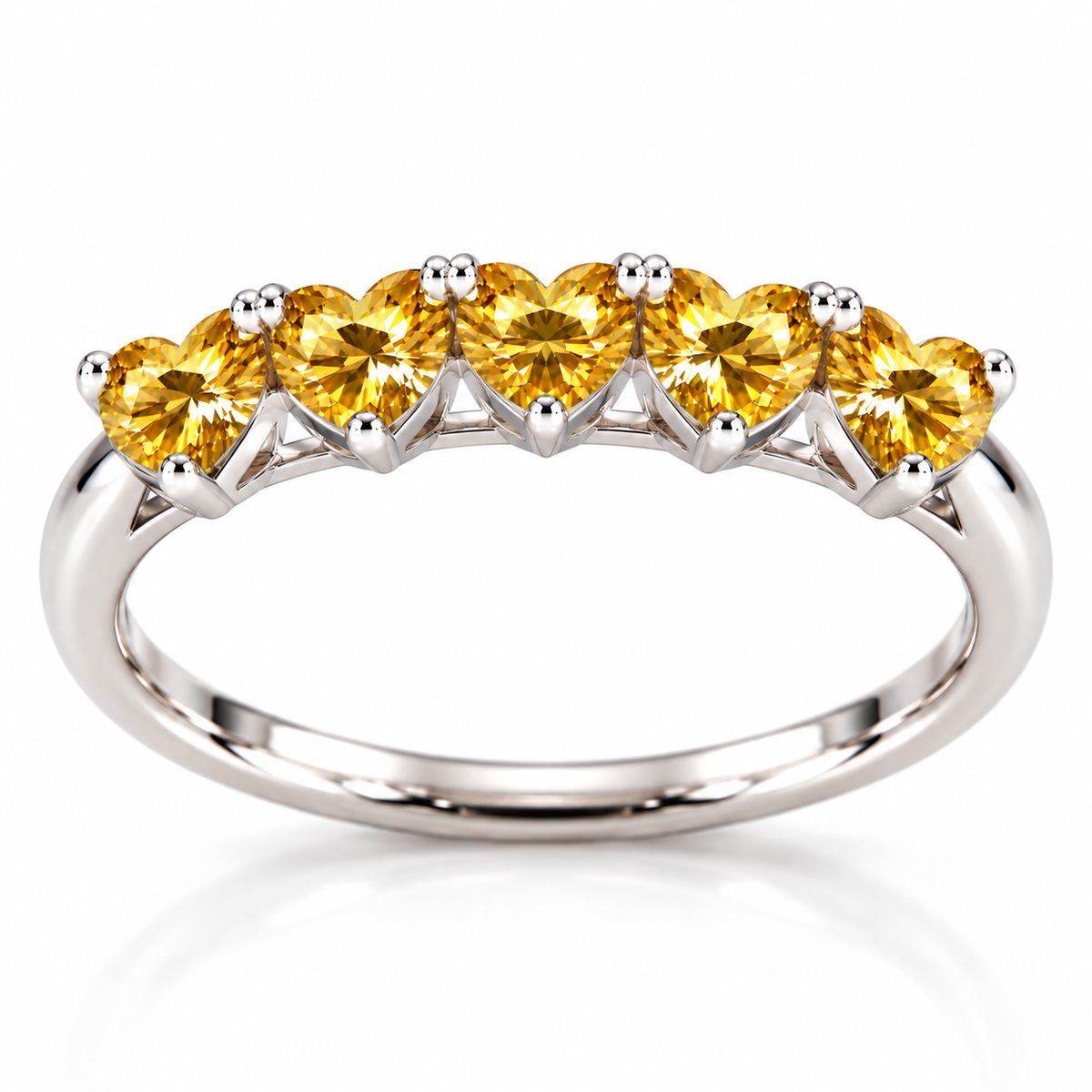 Side view showing five 4mm heart-cut yellow moissanite gemstones and the curved sterling silver ring band
