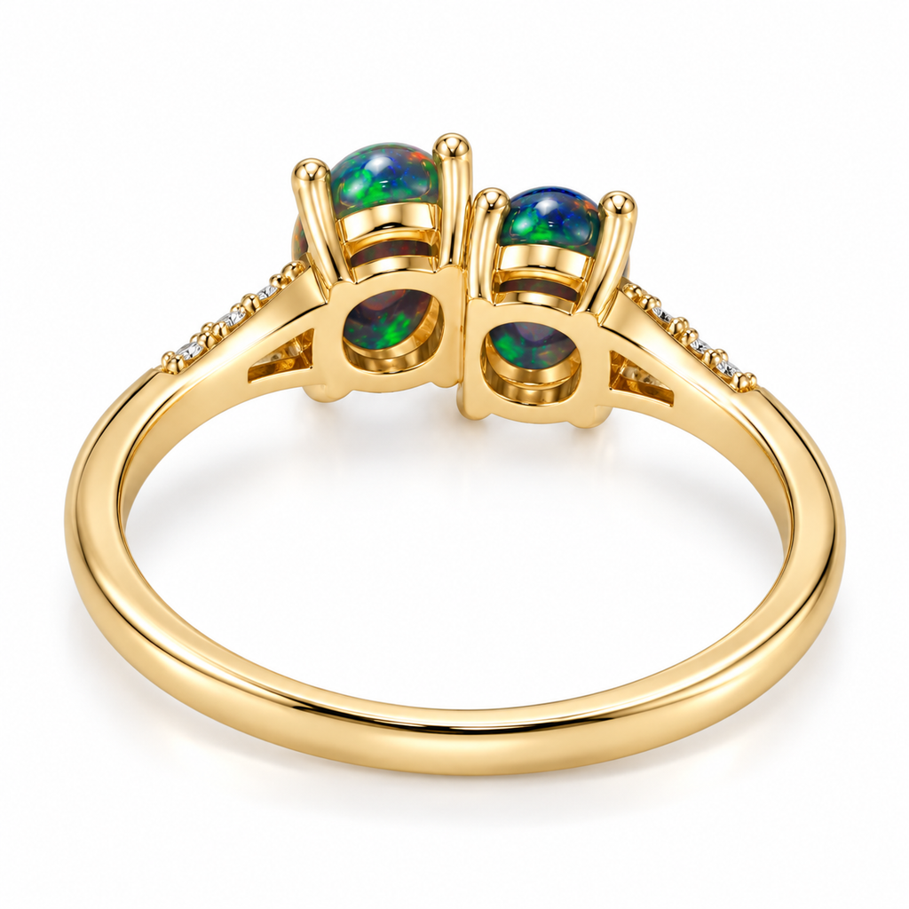 Rear underside view of a black fire opal two-stone ring showing individual oval gemstone galleries, open settings and polished Gold Plated sterling silver band.