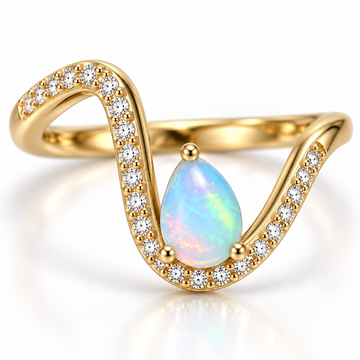 Macro view of the pear shaped 5x7mm natural opal and sparkling details on a gold plated ring