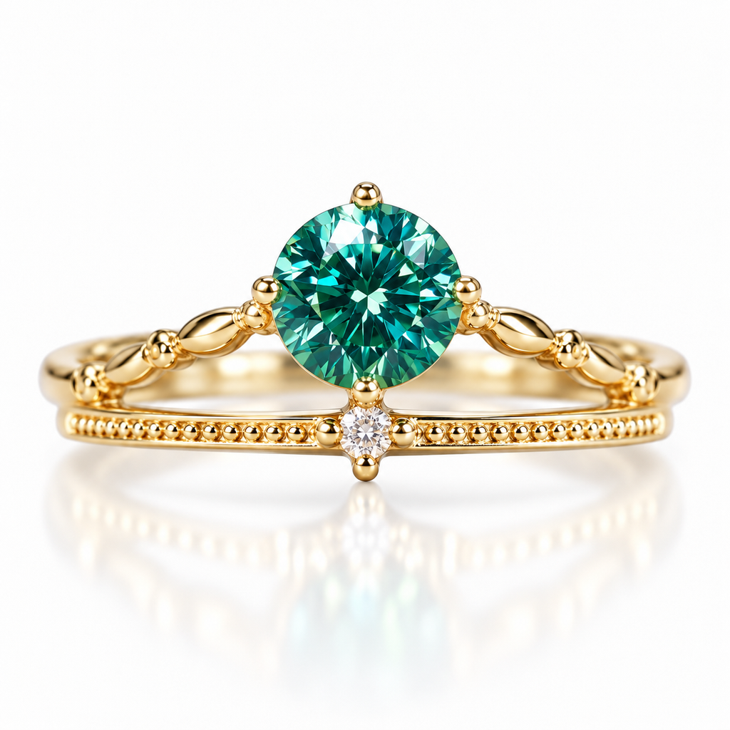 6.5mm lab-created round brilliant green moissanite ring featuring vibrant teal-green reflections, a polished four-prong gold-tone setting, decorative split-shank band, milgrain detailing, and a single clear cubic zirconia accent in Gold Plated 925 sterling silver on a white background.