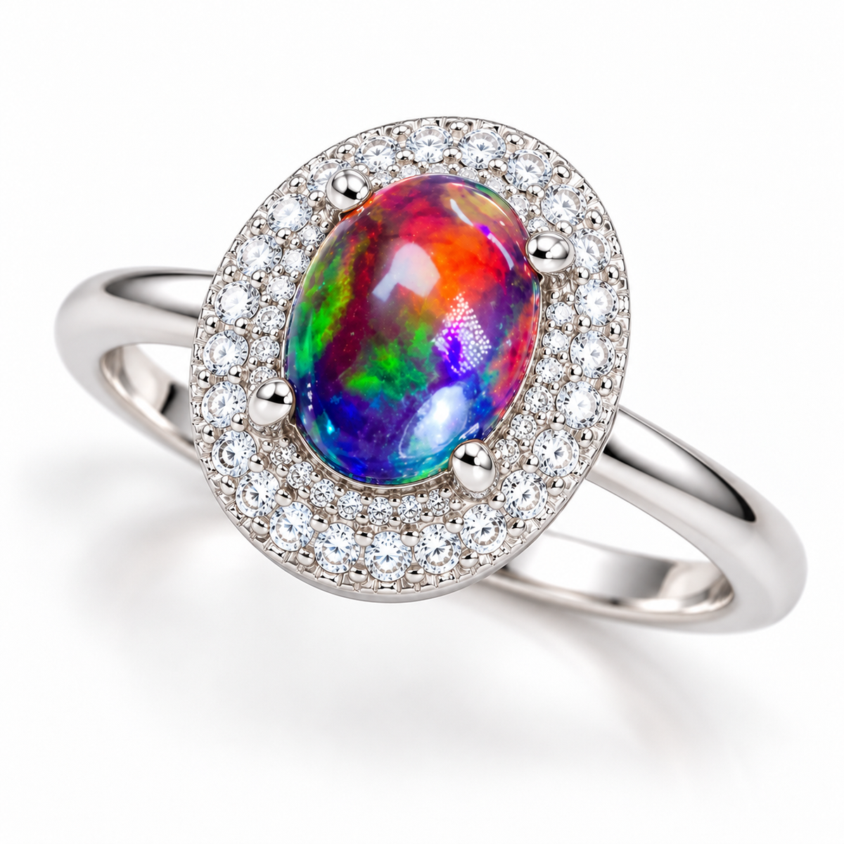 Three-quarter view of a 6x8mm Australian black fire opal halo ring with vivid red, orange, green, blue, and violet flashes, sparkling cubic zirconia accents, and polished silver band.