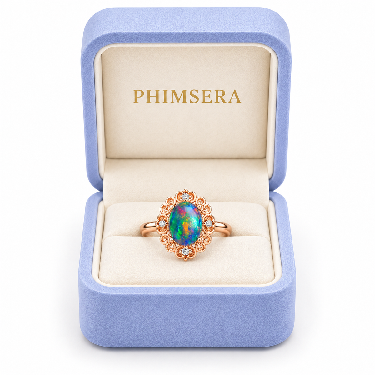 Australian black fire opal vintage filigree ring displayed inside a periwinkle Phimsera jewelry box with cream velvet interior and gold PHIMSERA lettering, featuring a 6x8mm oval gemstone.