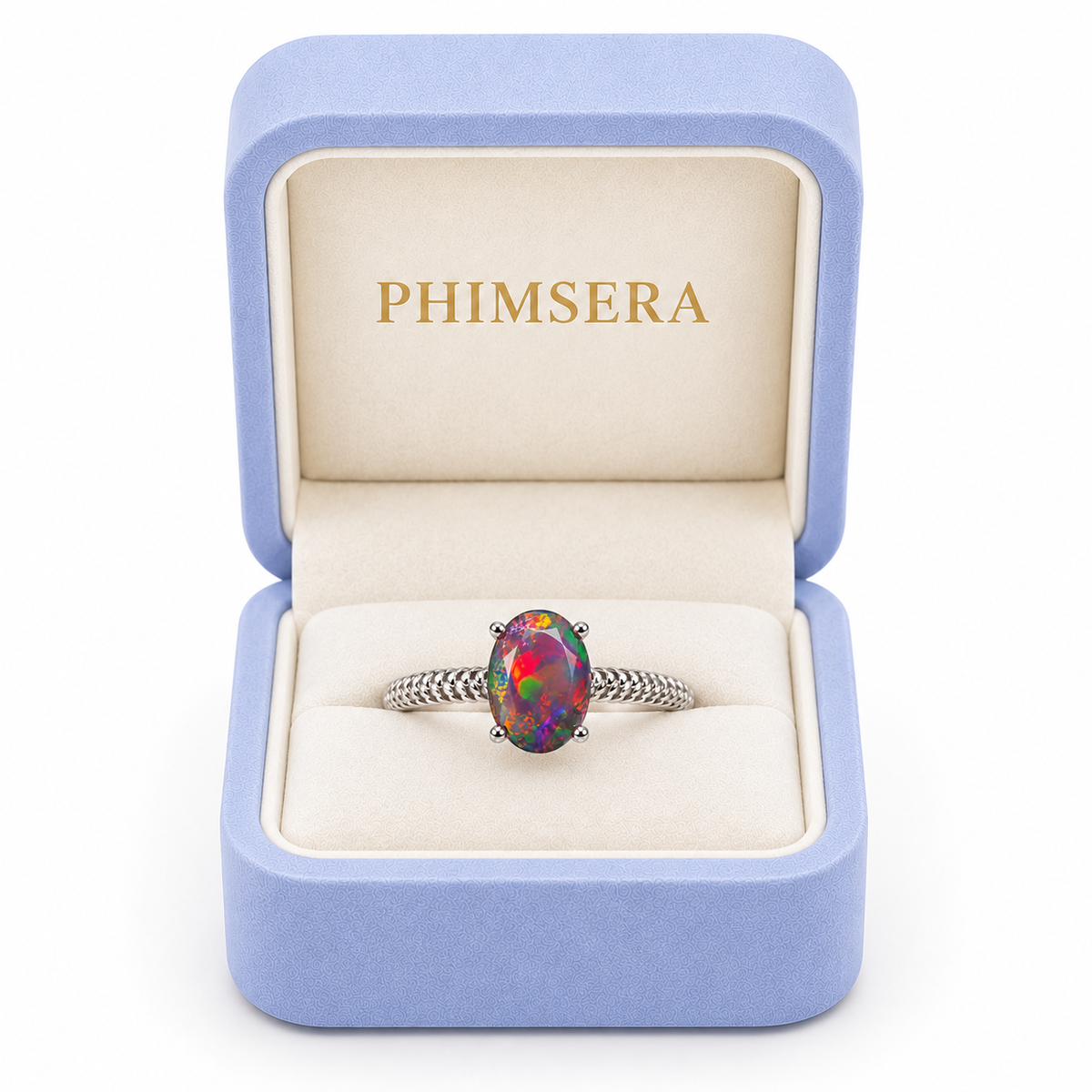 Australian black fire opal solitaire ring displayed inside a periwinkle Phimsera jewelry box with cream velvet interior and gold PHIMSERA lettering, featuring a colorful 6x8mm oval gemstone and textured silver band.