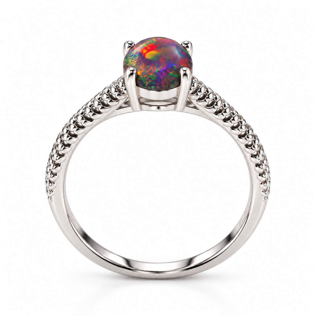 Side profile of a 6x8mm Australian black fire opal ring showing the oval gemstone setting, four polished metal prongs, decorative raised metallic ridges along the shoulders, and smooth Platinum Plated sterling silver band.