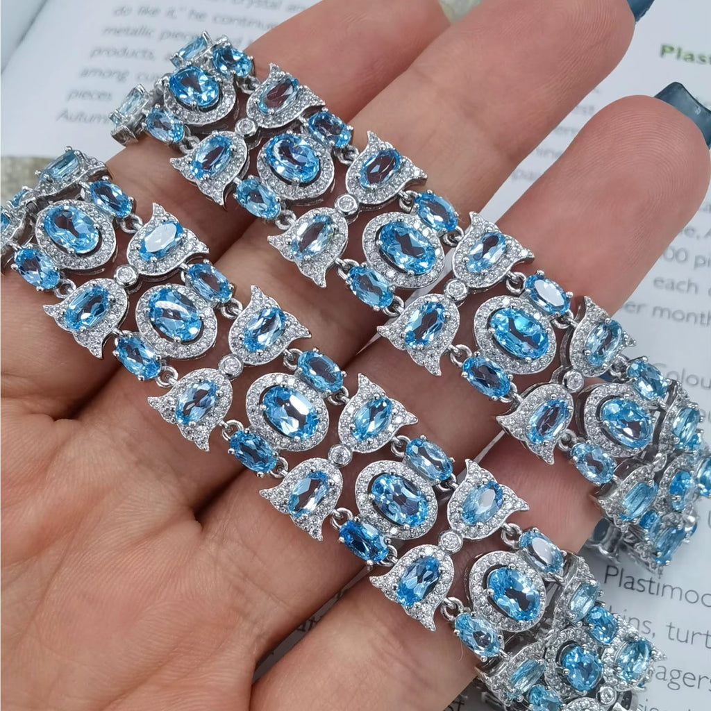 925 Silver Polished Natural Swiss Blue Topaz 4x6mm Oval-Cut Link Tennis Bracelet