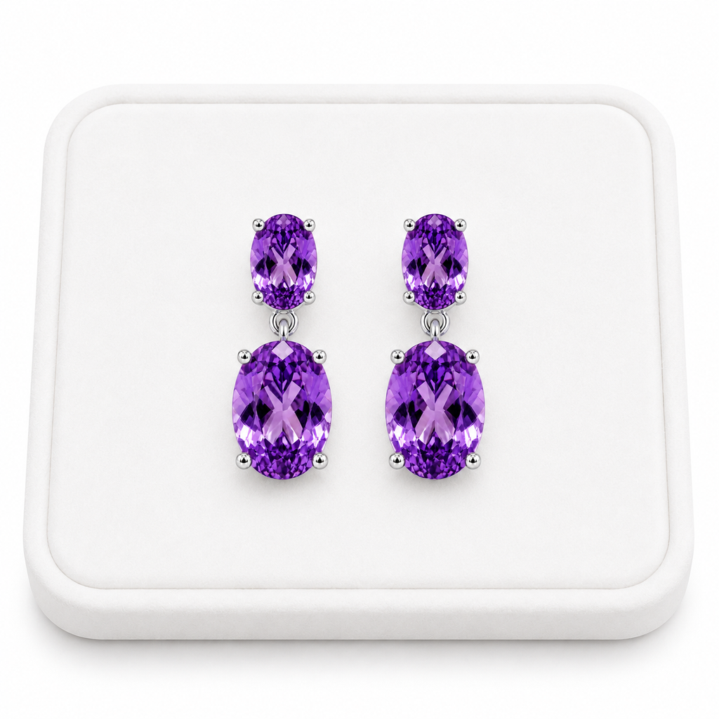 Natural Amethyst dangle earrings displayed on a white velvet jewelry tray