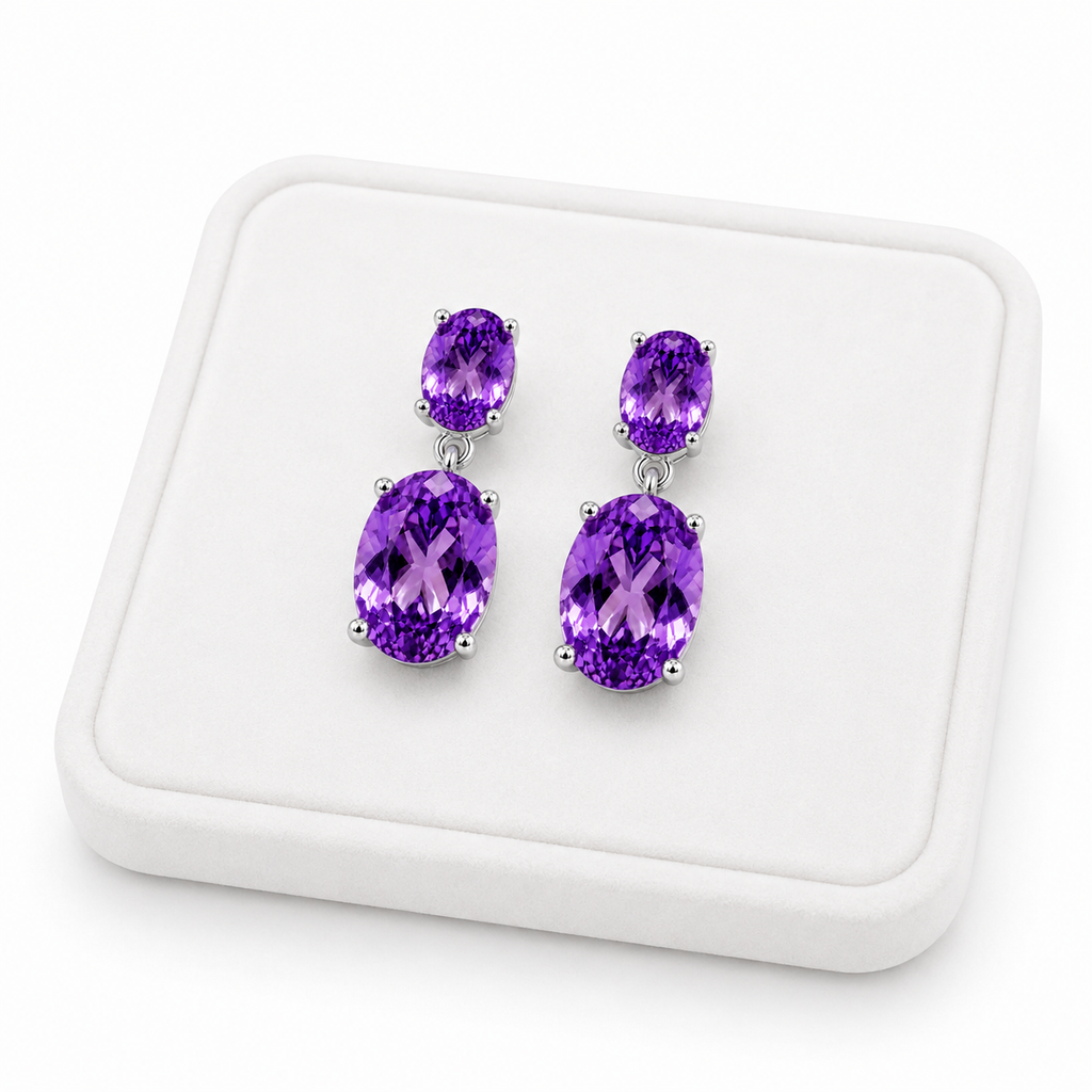 Natural Amethyst dangle earrings displayed on a white velvet jewelry tray
