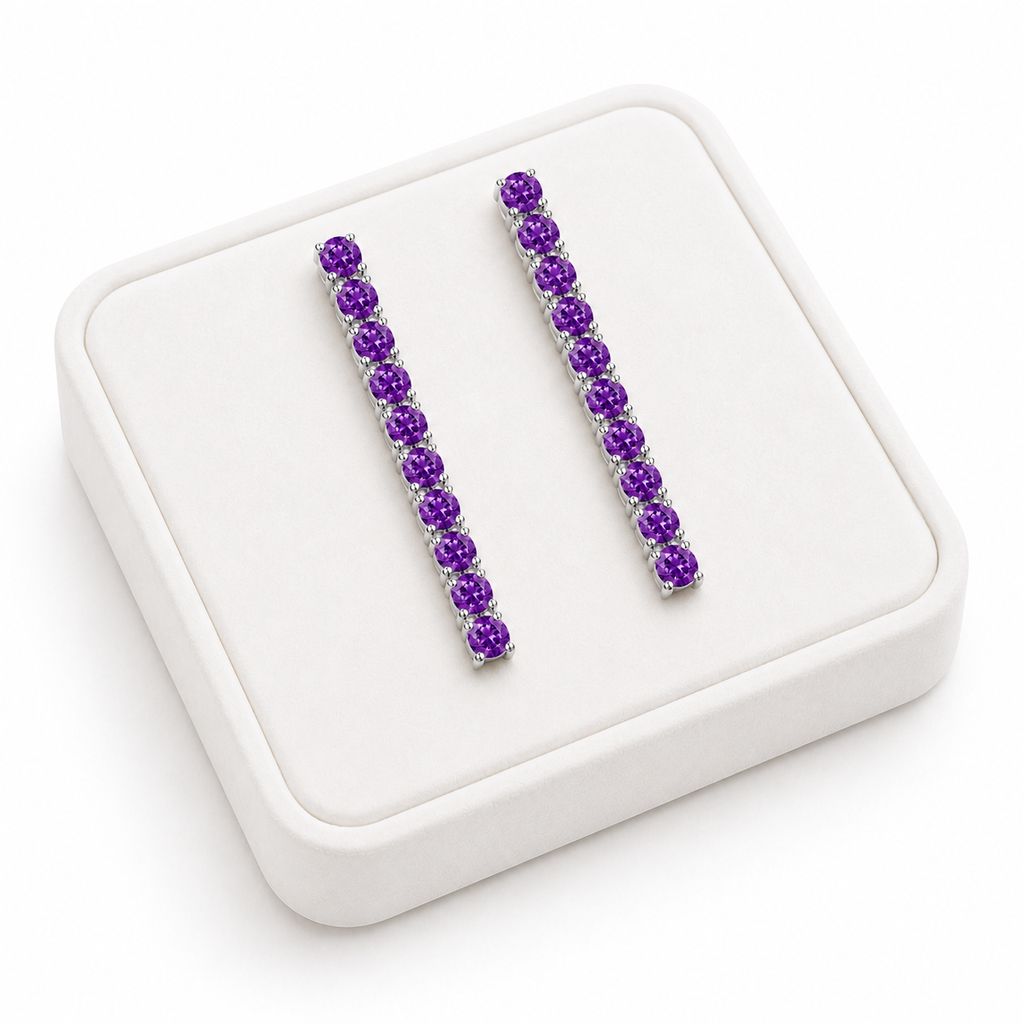 Phimsera natural amethyst dangle earrings displayed on a white velvet jewelry tray against a bright white background