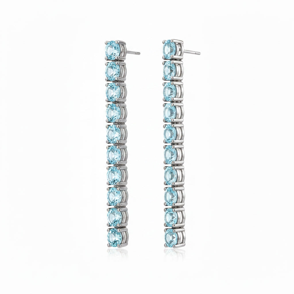Close angled view of Phimsera 3mm round blue aquamarine dangle earrings featuring 10 gemstones on each earring