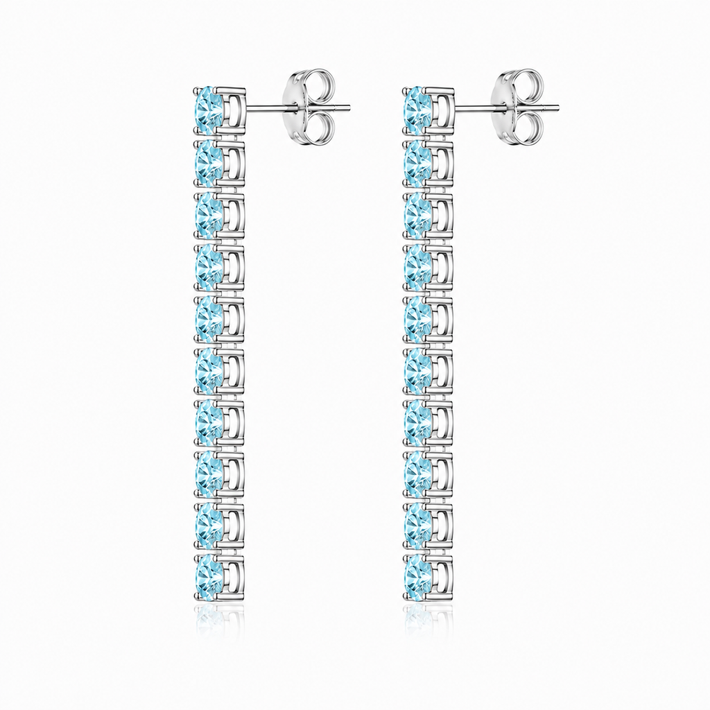 Side view of Phimsera natural aquamarine dangle earrings showing the elongated vertical gemstone design and sterling silver settings