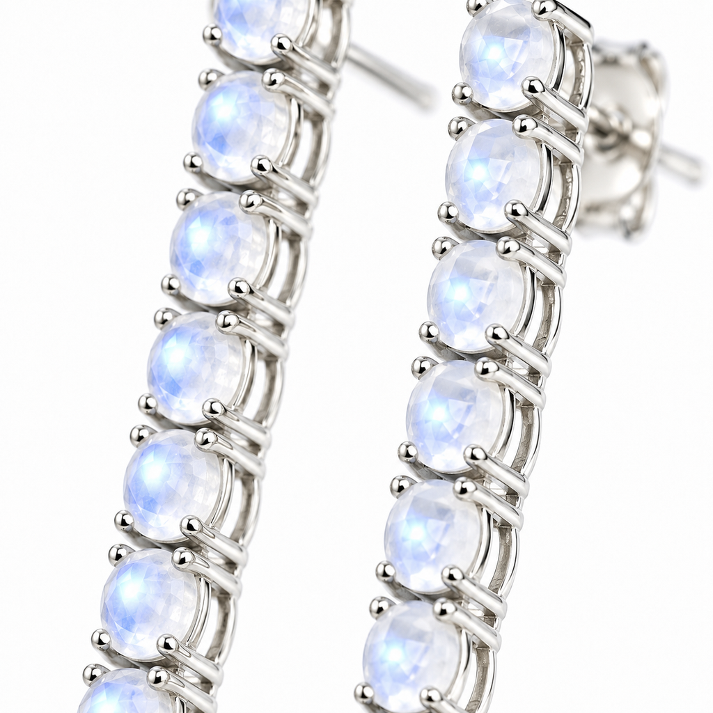 Macro view of natural 3mm round moonstone gemstones with a soft luminous appearance in Phimsera sterling silver earrings