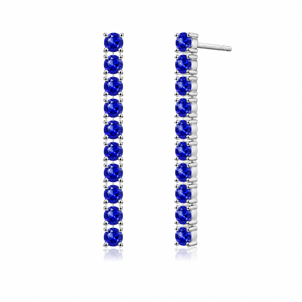 Side view of Phimsera natural sapphire dangle earrings showing the elongated vertical gemstone design and sterling silver settings