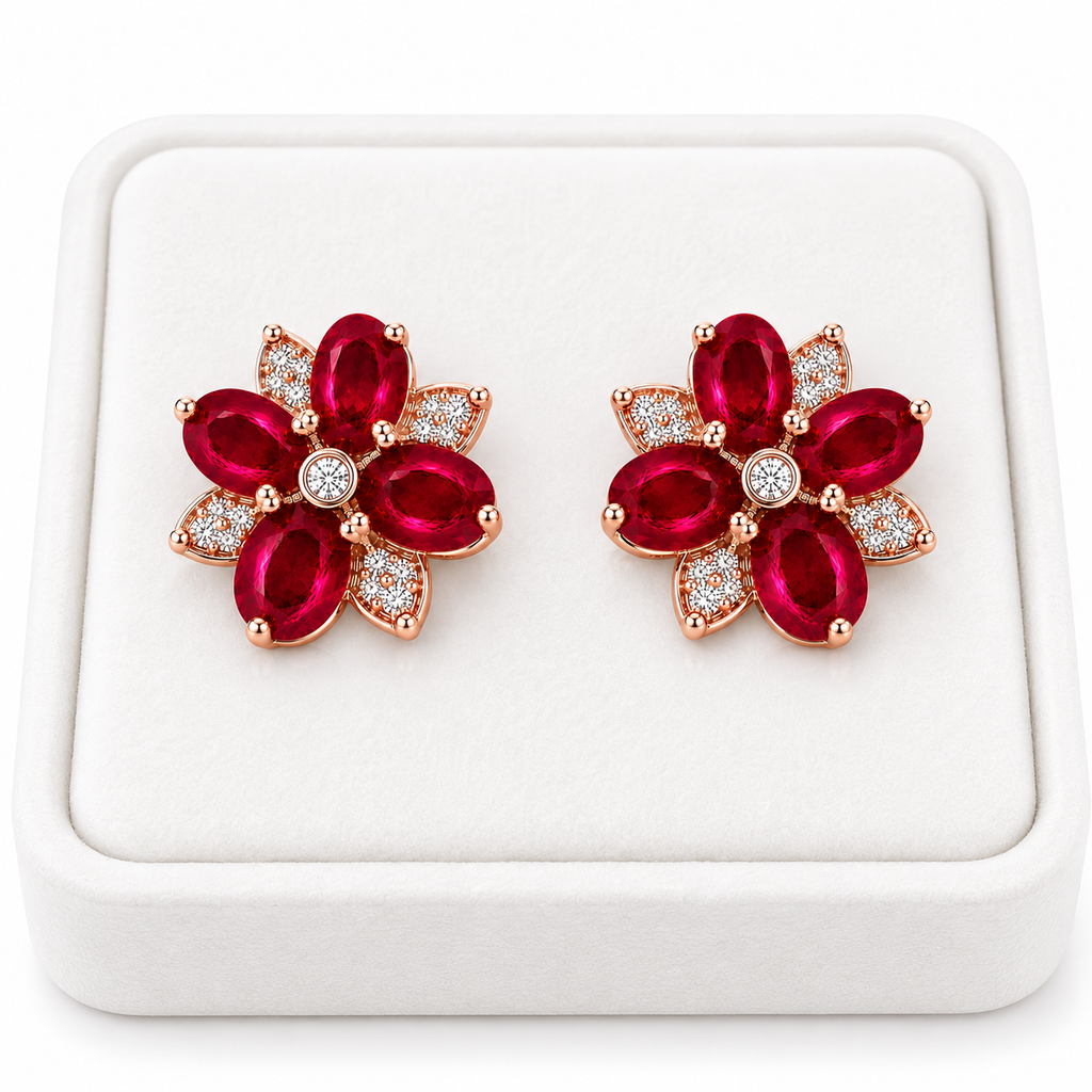Natural ruby flower earrings displayed on white jewelry tray