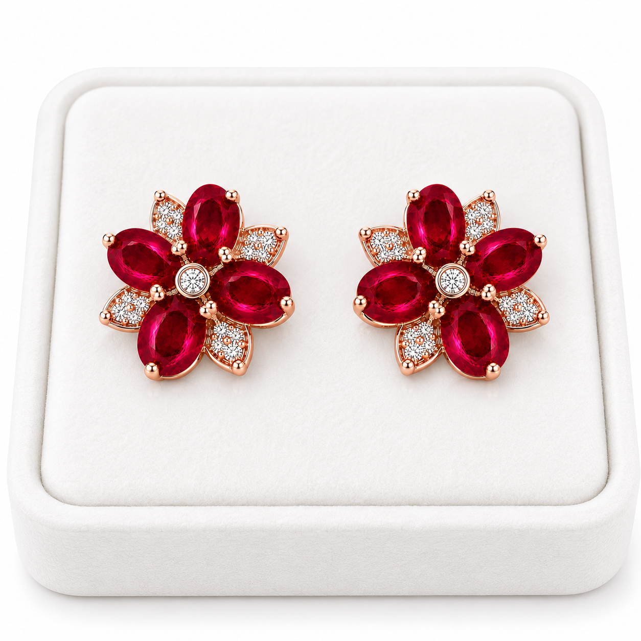 Natural ruby flower earrings displayed on white jewelry tray
