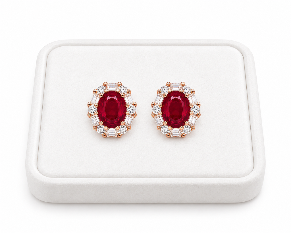 Natural 4x5mm ruby stud earrings displayed on a white jewelry tray