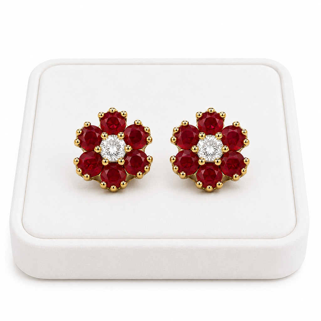 Natural ruby flower stud earrings displayed on a white jewelry tray