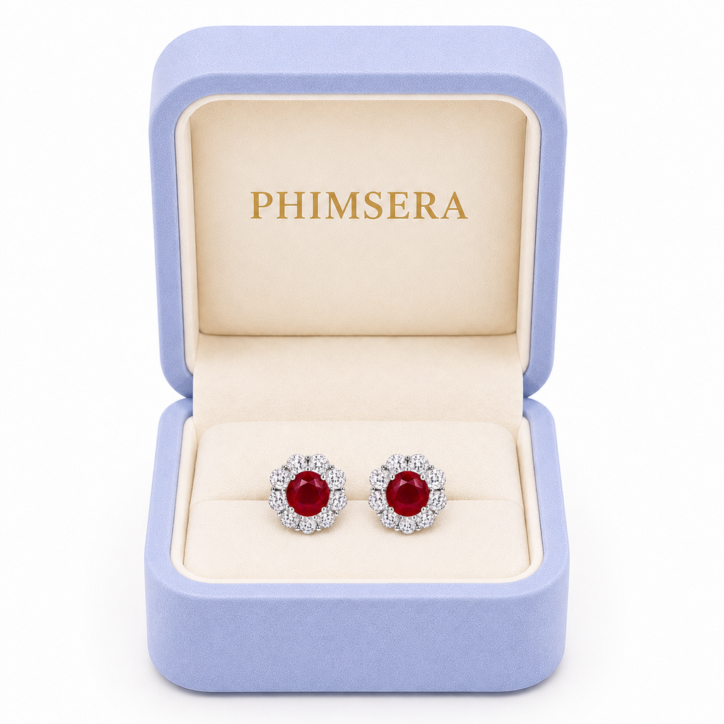 Natural 4mm ruby halo stud earrings displayed in Phimsera jewelry gift box