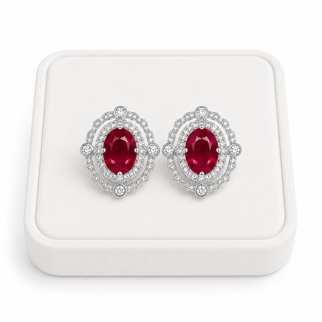 Natural 3 CTW ruby earrings displayed on a white jewelry tray with luxury studio lighting