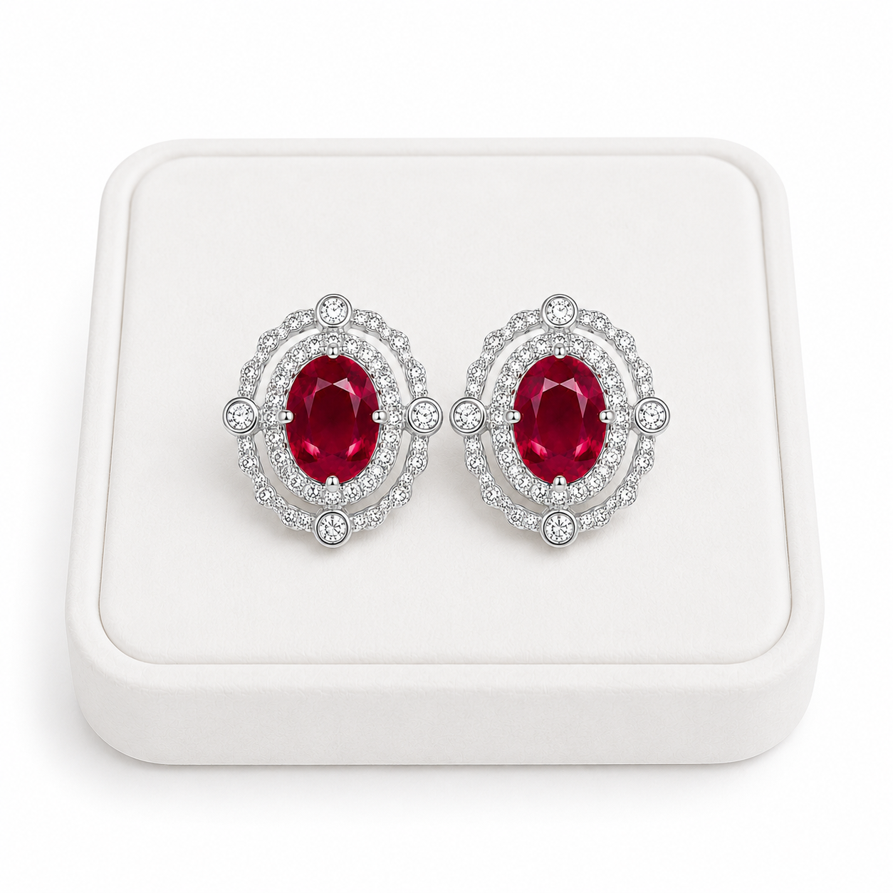 Natural 3 CTW ruby earrings displayed on a white jewelry tray with luxury studio lighting