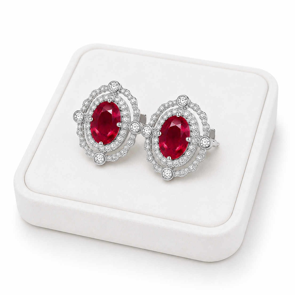 Natural 3 CTW ruby earrings displayed on a white jewelry tray with luxury studio lighting