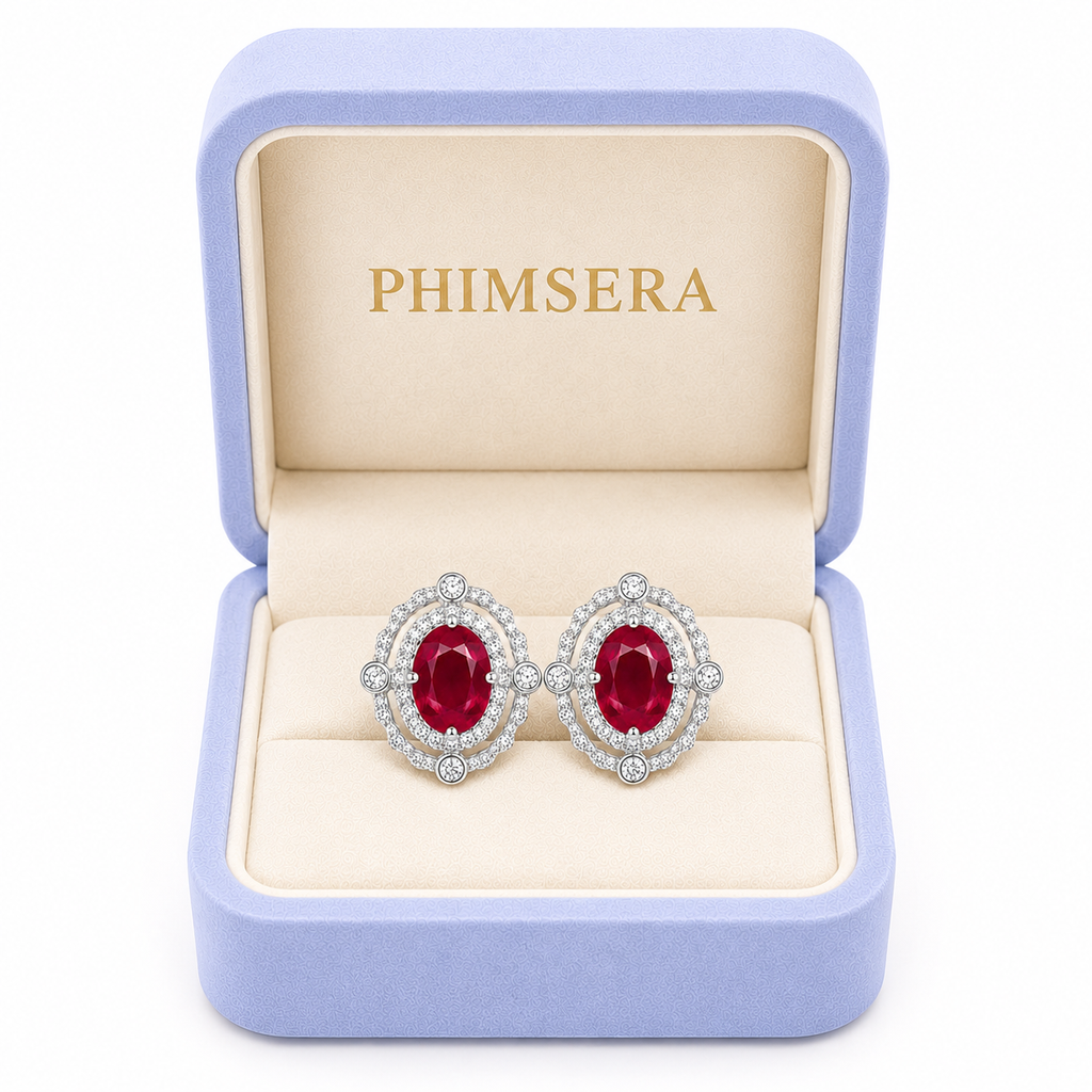 Natural 6x8mm ruby earrings displayed in Phimsera jewelry gift box