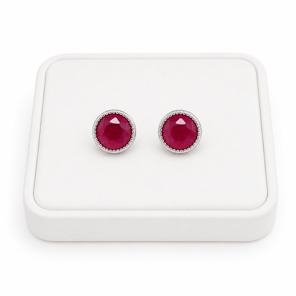 Phimsera 5mm natural ruby stud earrings displayed on white jewelry tray