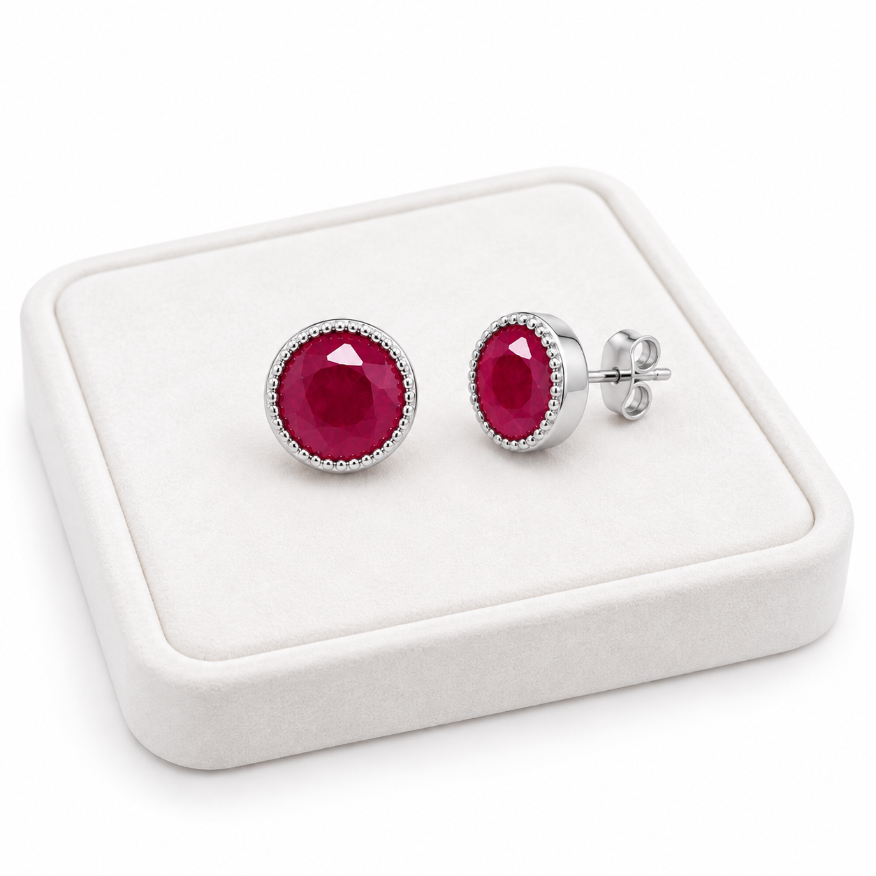 Phimsera 5mm natural ruby stud earrings displayed on white jewelry tray