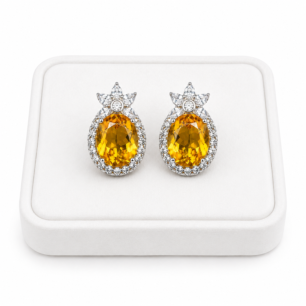 Natural 8x10mm citrine stud earrings displayed on a luxury white jewelry tray