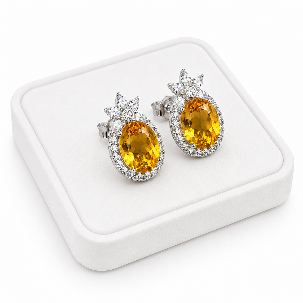 Natural 8x10mm citrine stud earrings displayed on a luxury white jewelry tray