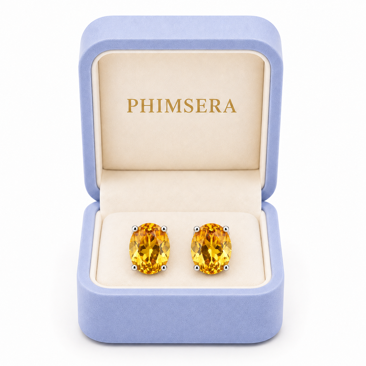 Natural 7x9mm citrine stud earrings displayed in Phimsera jewelry gift box