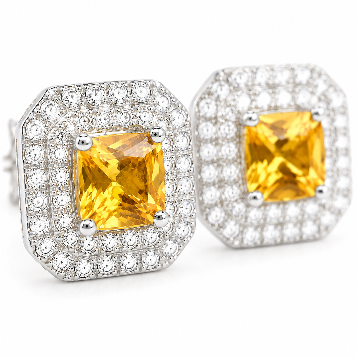 Macro close-up of natural golden citrine gemstones surrounded by double cubic zirconia halos