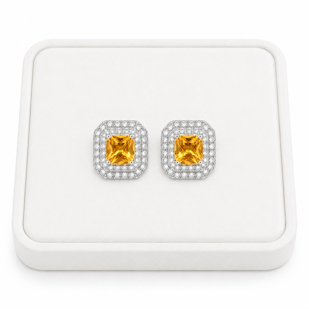 Natural 4mm citrine double halo earrings displayed on white jewelry tray